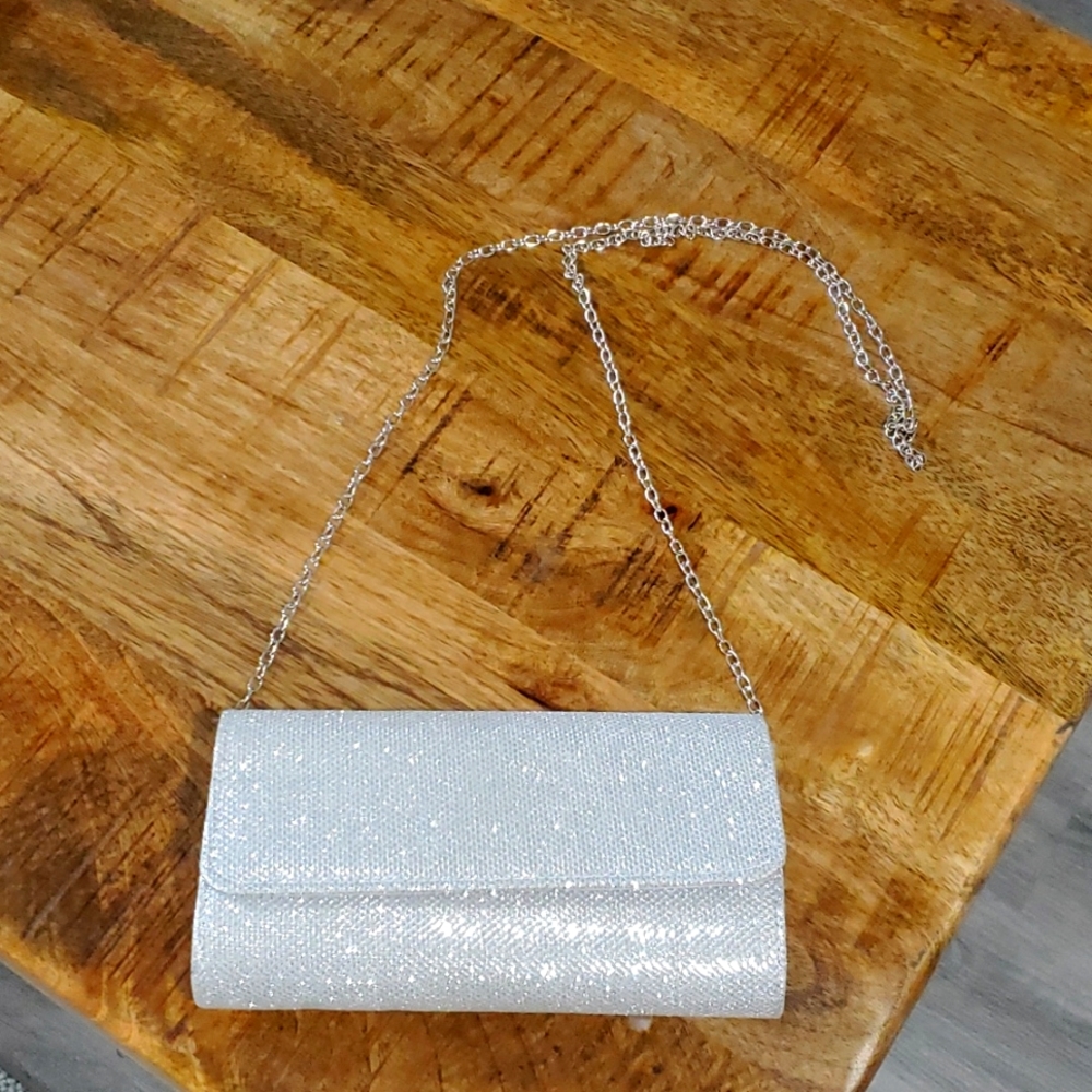 Silver glitter shoulder/clutch with silver chain.